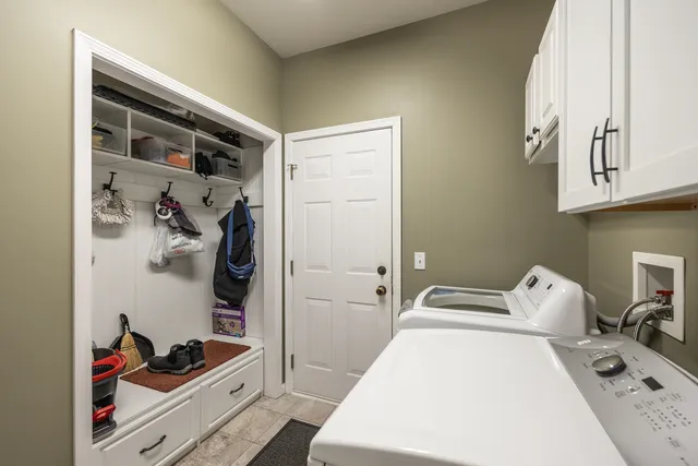 a bedroom with a bed and a dresser in it