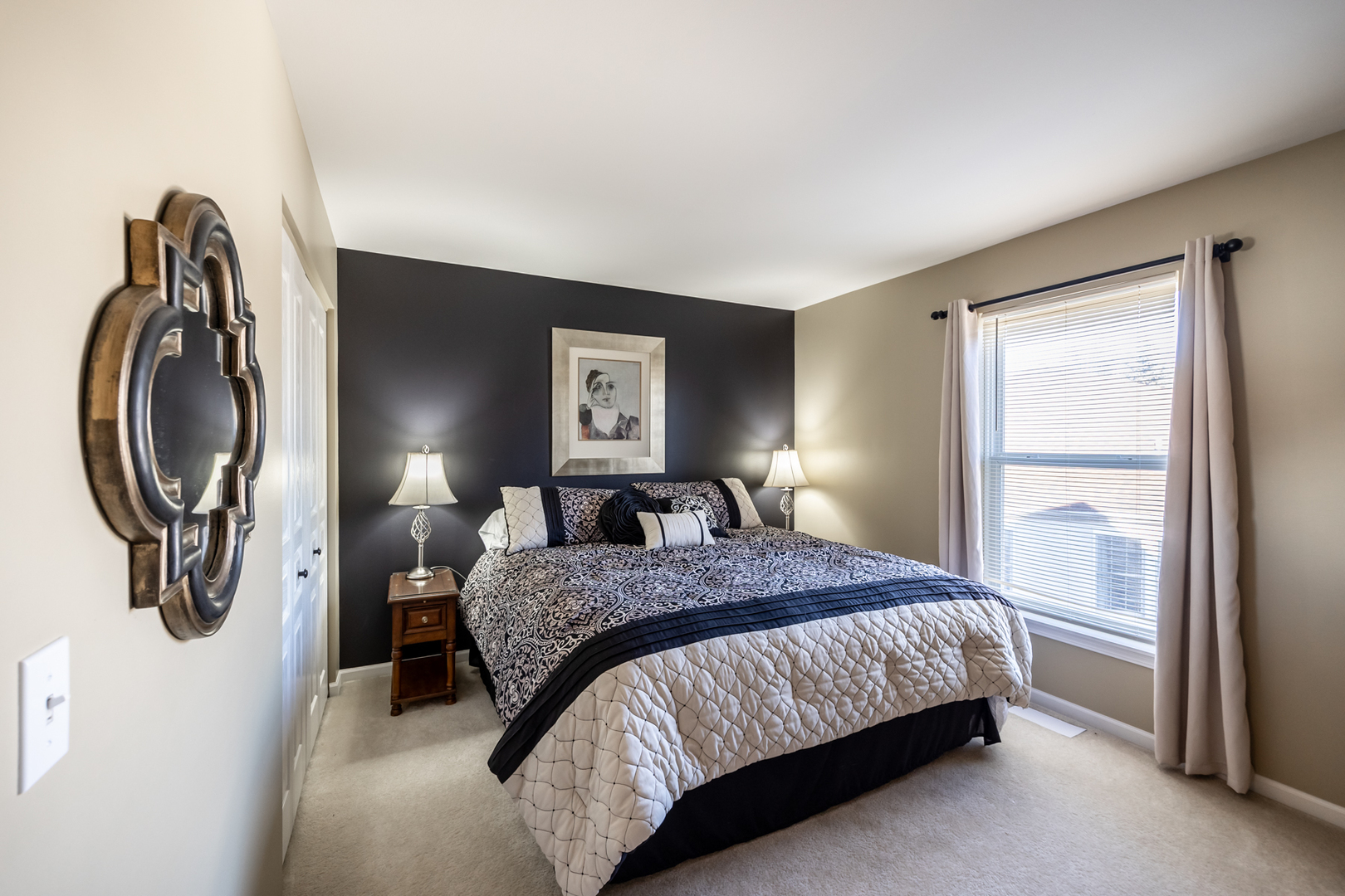 2737 Winton Court West Dundee, IL 60118 - Photo 36 of 52 a bedroom with a bed a mirror on dresser and a window