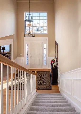 a view of a porch with wooden floor and windows