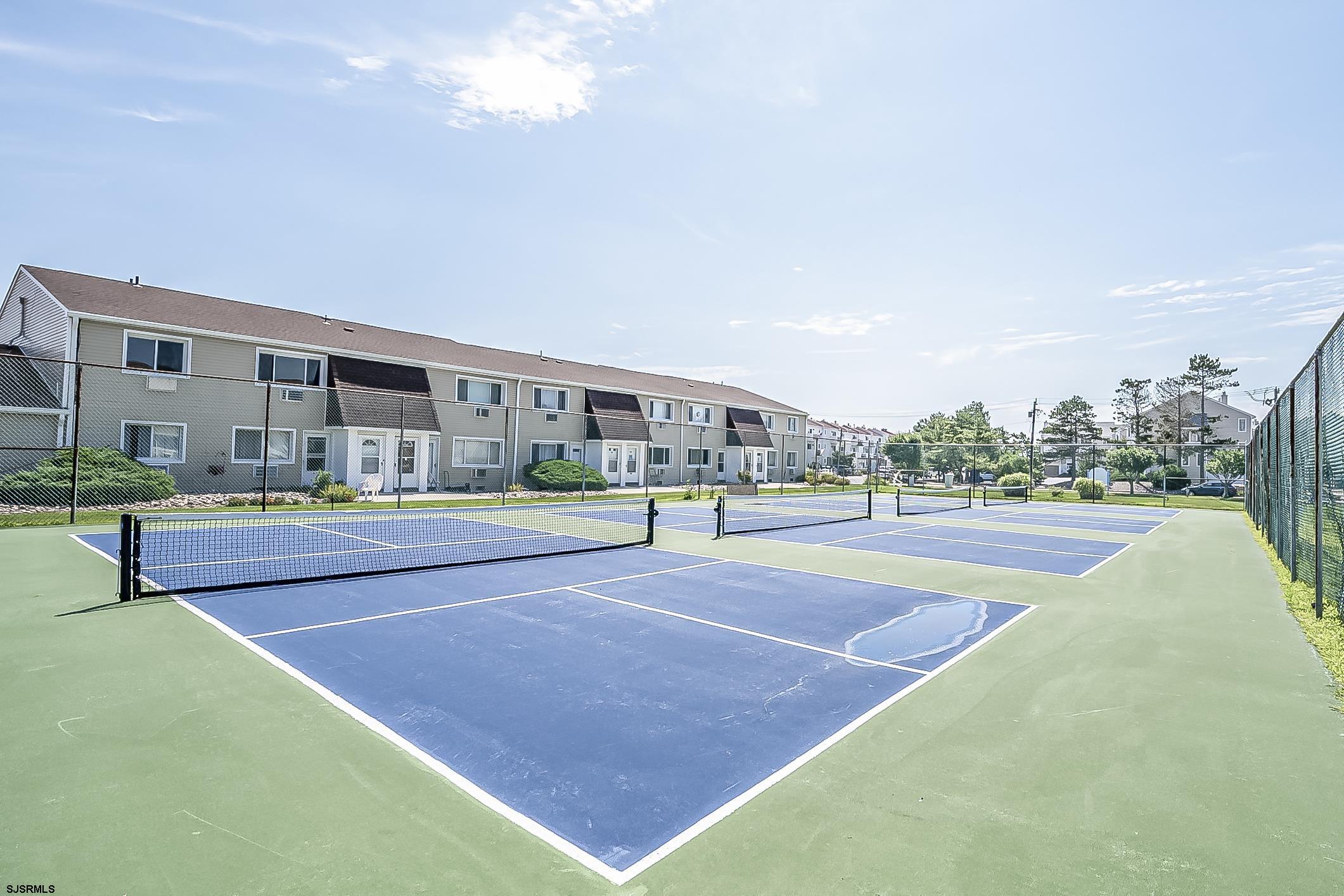4901 Harbor Beach Boulevard, Unit Q3 Brigantine, NJ 08203 - Photo 14 of 19 a swimming pool with outdoor seating and plants