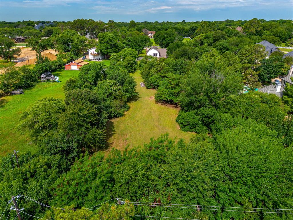 7404 John McCain Road Colleyville, TX 76034 - Photo 5 of 21 a view of a lush green field with plants