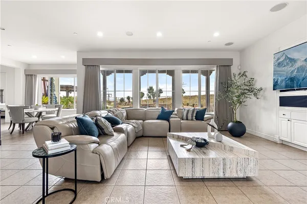 a dining room with furniture and window