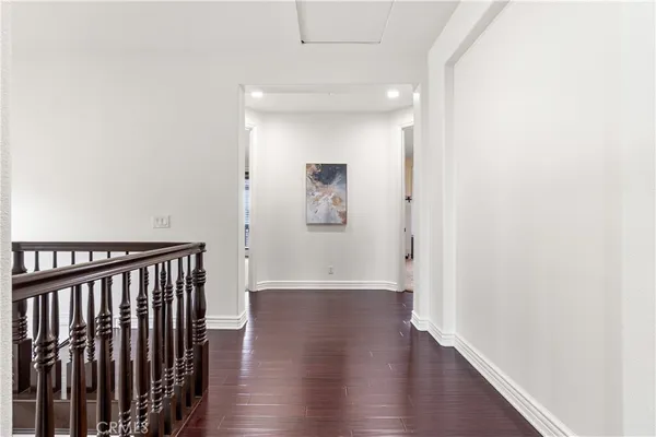 a bedroom with a bed lamp and a window