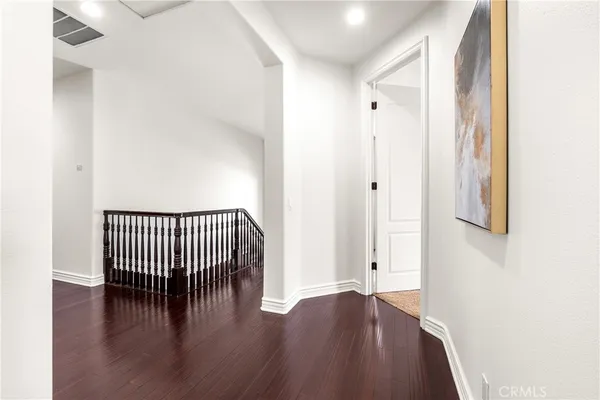 a spacious bedroom with a bed and a fireplace