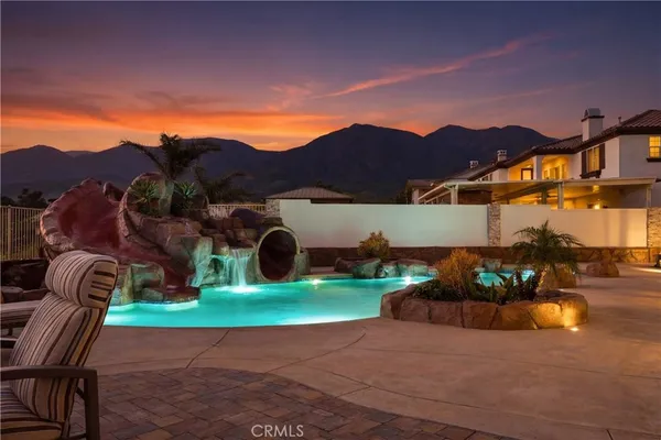 a view of a house with outdoor space and sitting area