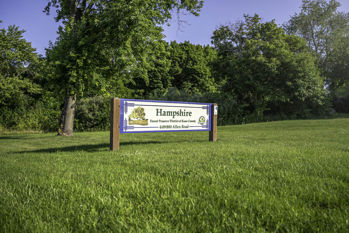 2561 Tahoe Lane Pingree Grove, IL 60140 - Photo 46 of 56 a sign of golf club on a wall under a tree