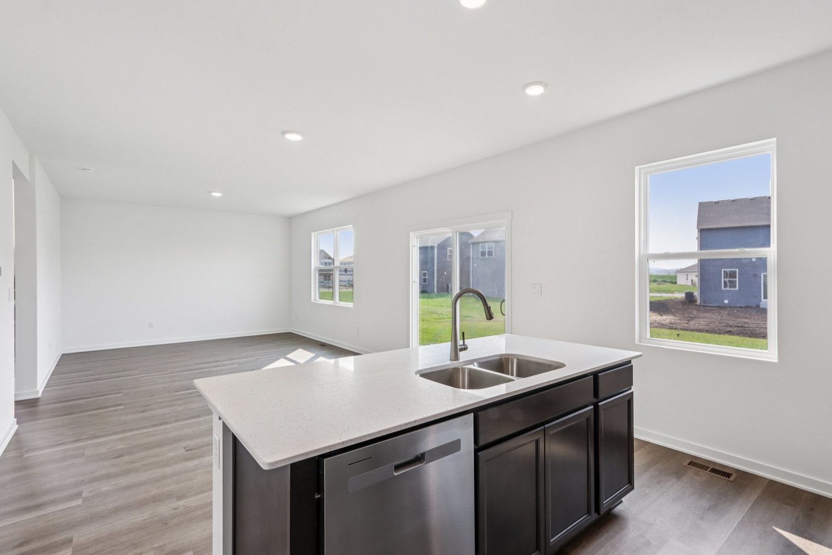 2561 Tahoe Lane Pingree Grove, IL 60140 - Photo 10 of 56 a kitchen with a sink cabinets and wooden floor