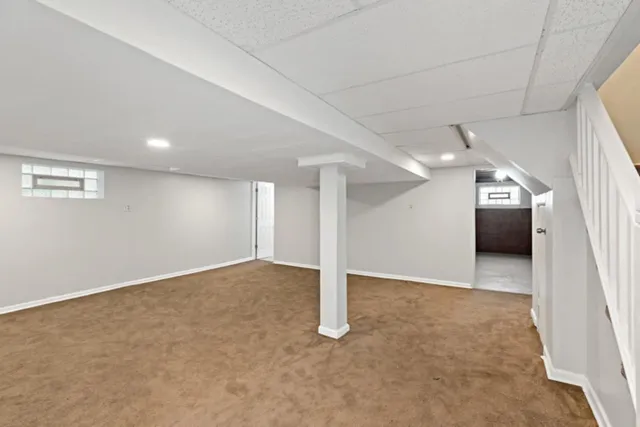 a bathroom with a toilet a sink and a mirror