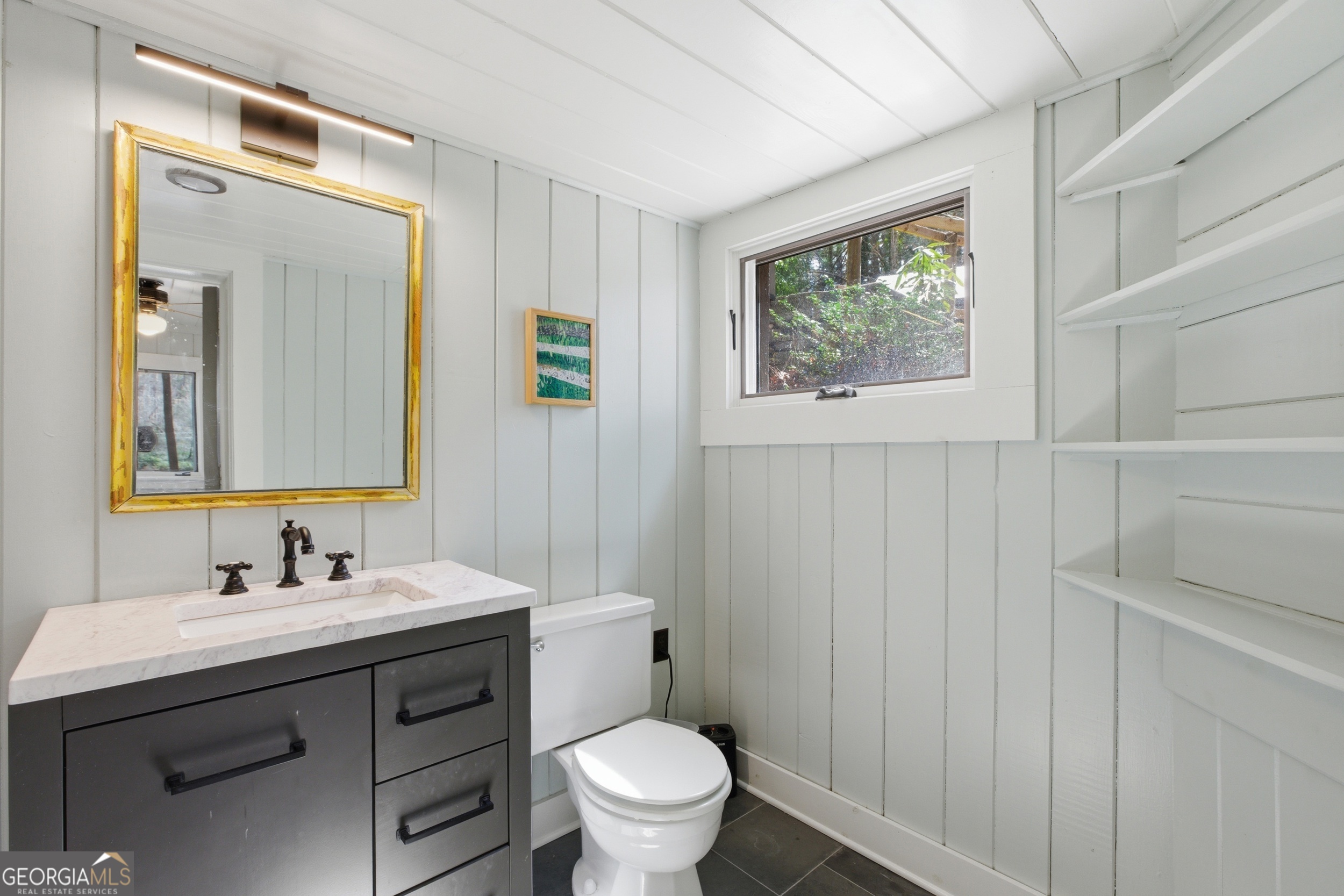 1921 Franklin Road Highlands, NC 28741 - Photo 39 of 72 a bathroom with a sink toilet and mirror