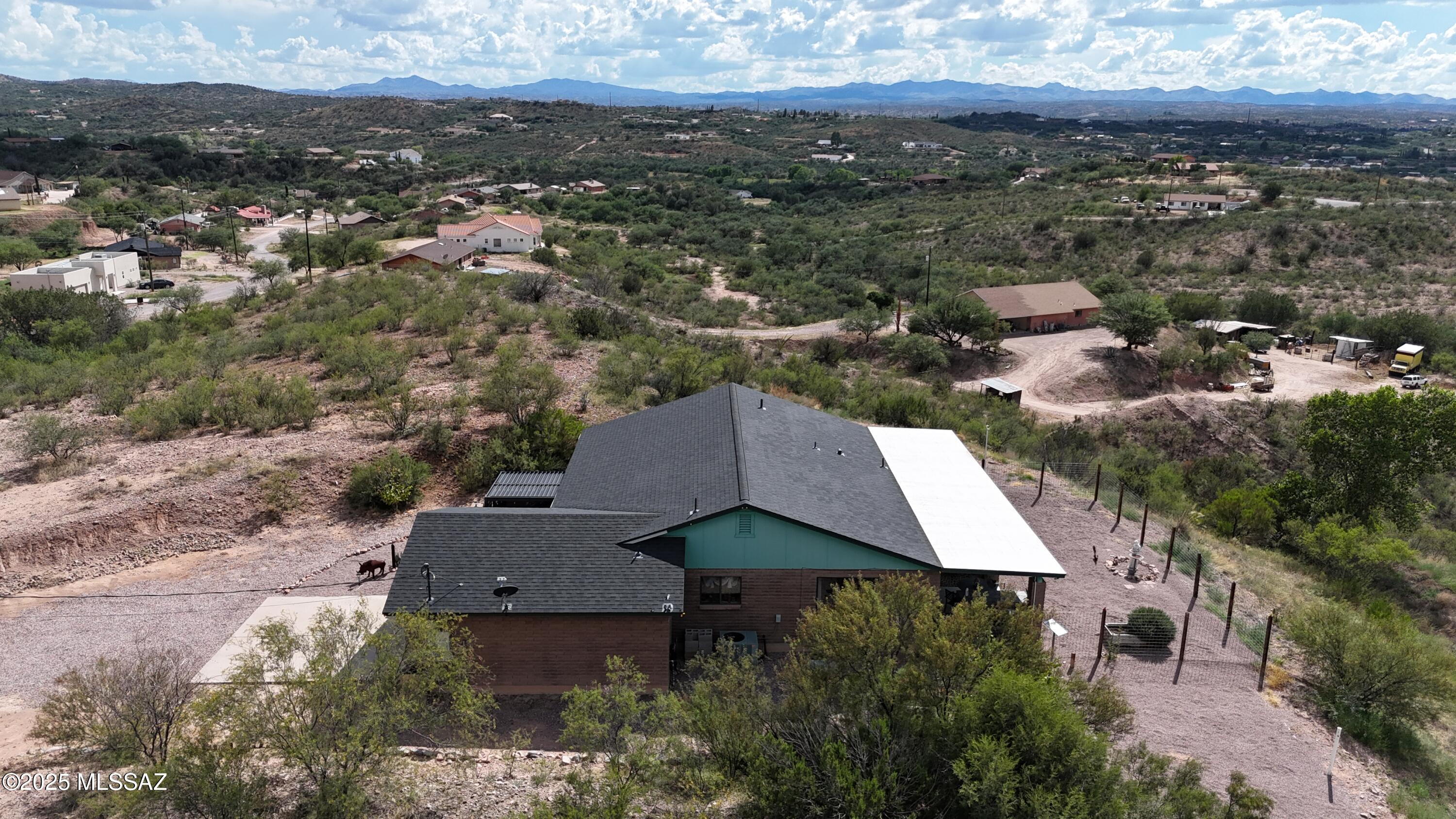 995 Jar Court Rio Rico, AZ 85648 - Photo 38 of 44 an aerial view of a house with yard and mountain view in back