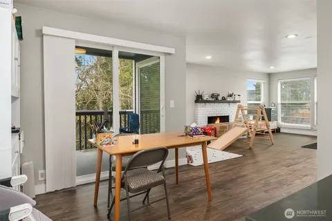 a view of a dining room with furniture window and wooden floor