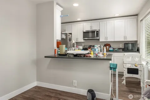 a kitchen with stainless steel appliances granite countertop a refrigerator sink and cabinets