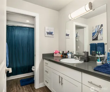 a bathroom with a sink double vanity and a mirror
