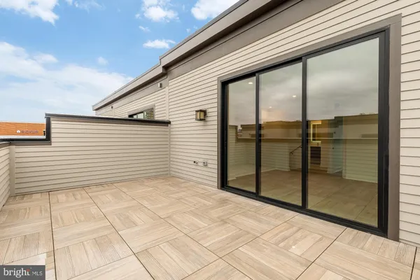 a bathroom with a toilet sink and shower