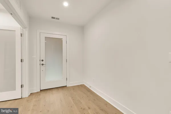 a view of an empty room with windows