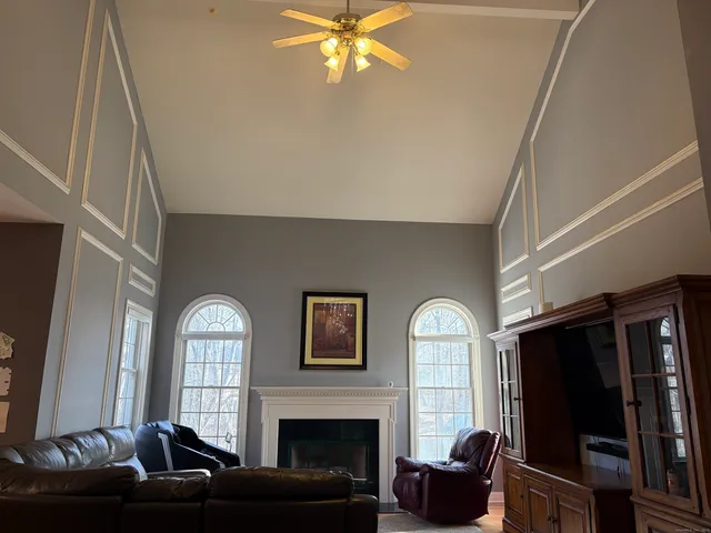 a view of a dining room with furniture and chandelier