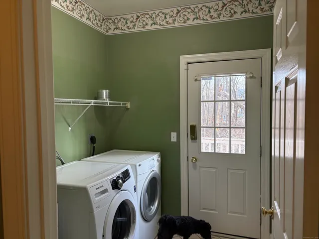 a spacious bedroom with a bed and a window