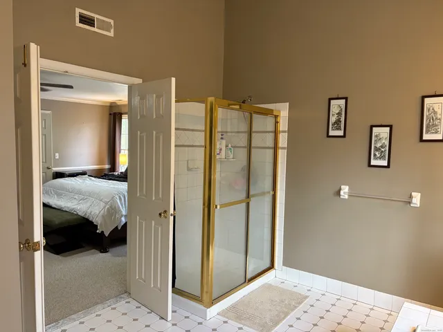a living room with furniture a window and a flat screen tv