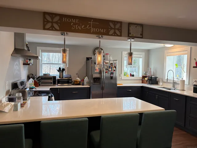 a view of a living room and a kitchen