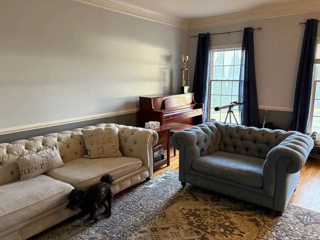 a living room with furniture and a window