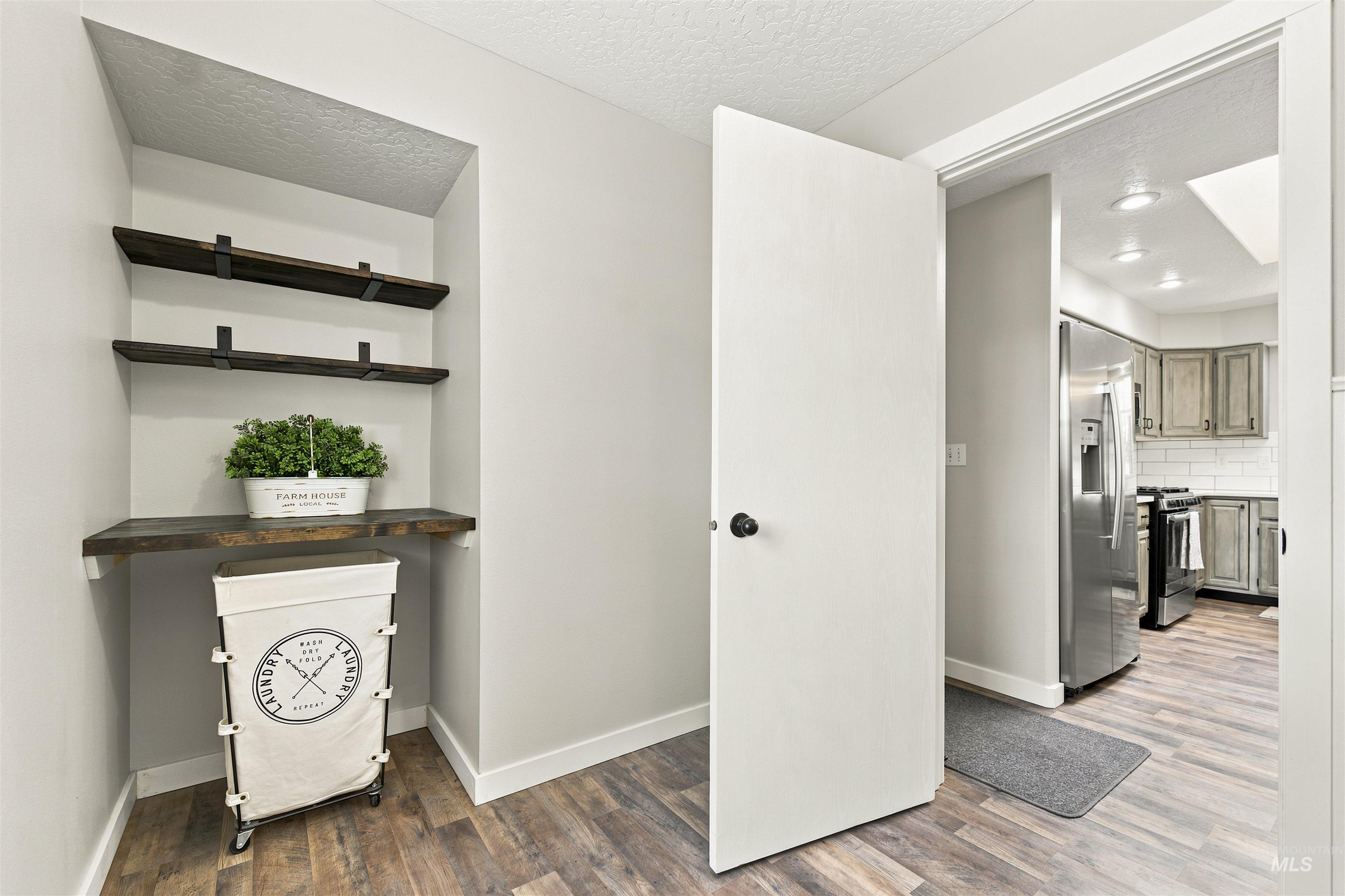 24864 Coventry Drive Caldwell, ID 83607 - Photo 17 of 49 Built-in shelving unit with three wood-finish shelves