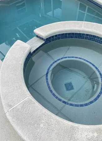 a view of swimming pool from a lake view