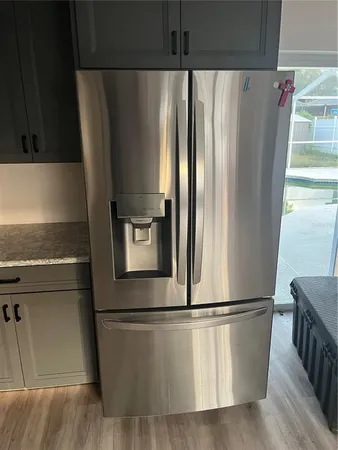 view of stainless steel appliances with refrigerator