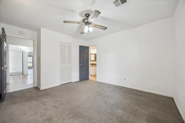 a view of an empty room with a bathroom