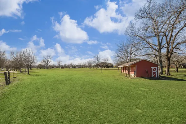 a view of a house with a big yard