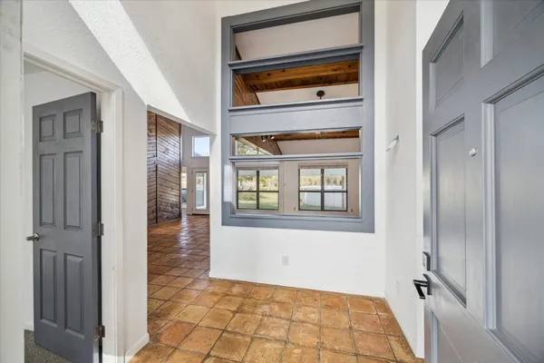 a view of entryway with wooden floor