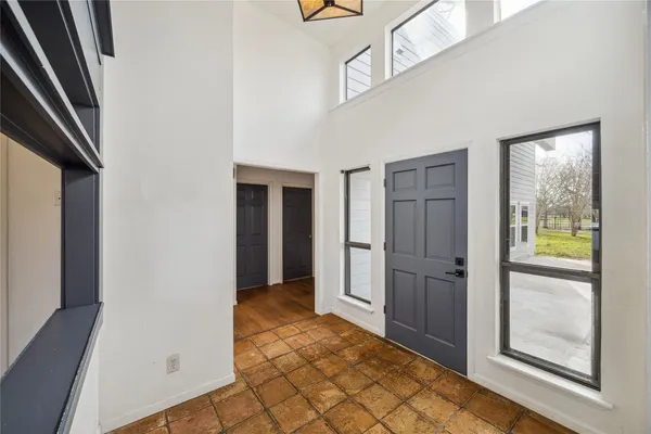 a view of an empty room with a ceiling fan
