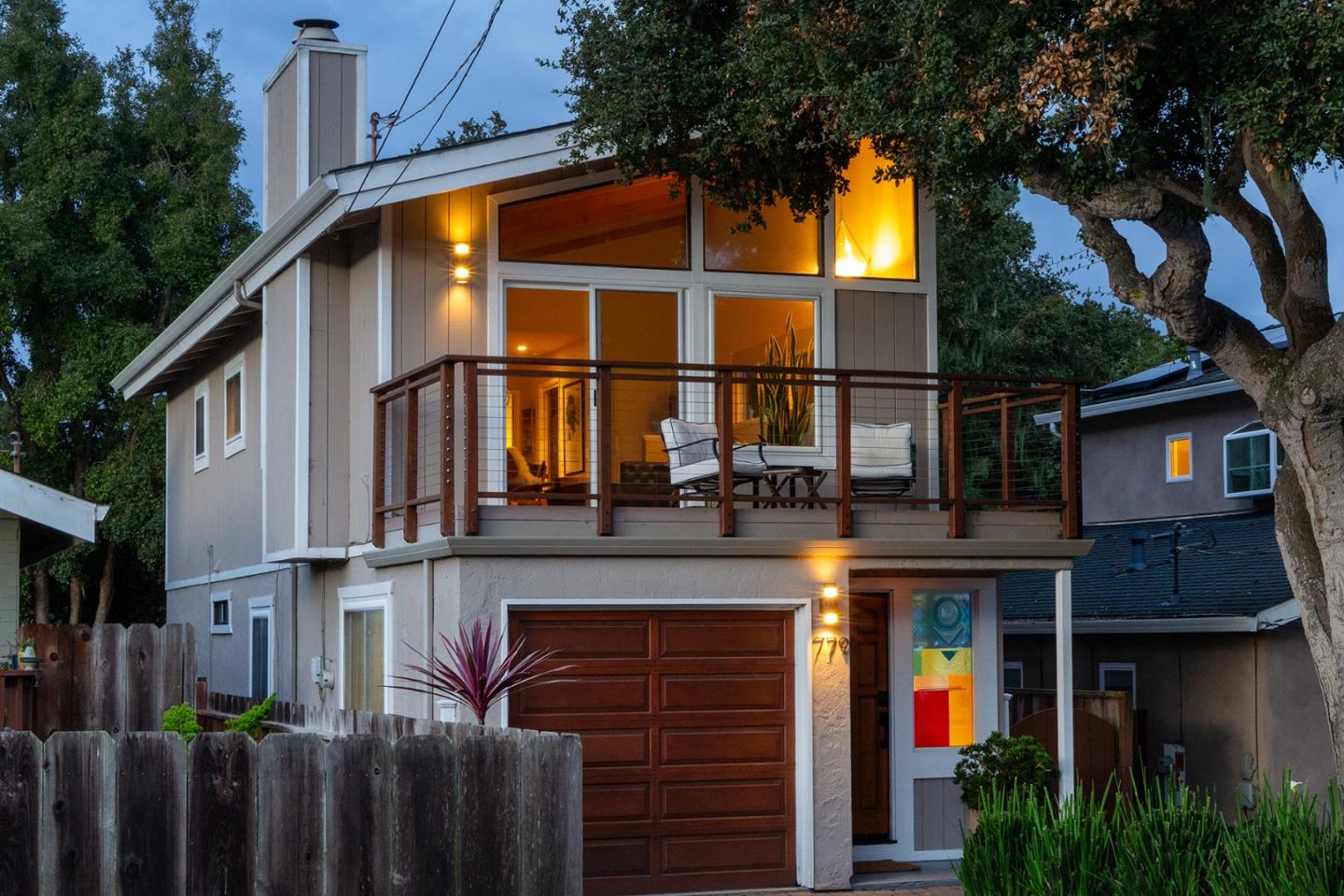 779 Alice Street Monterey, CA 93940 - Photo 2 of 27 a view of a house with a garage and balcony