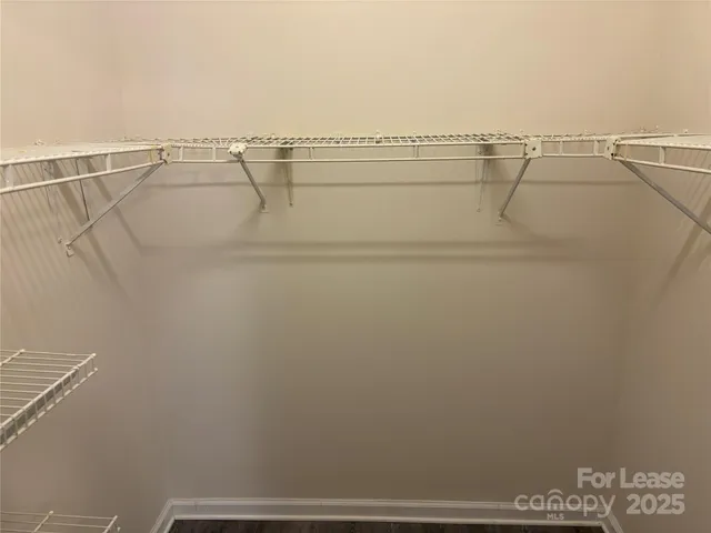 a view of a room with racks on the wall