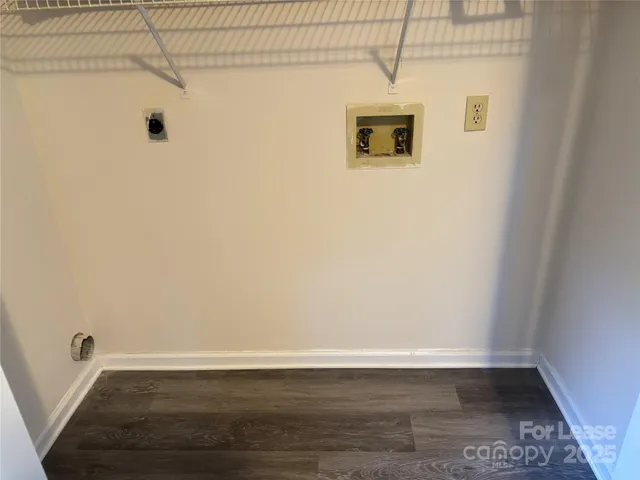 a view of a small space with wooden floor