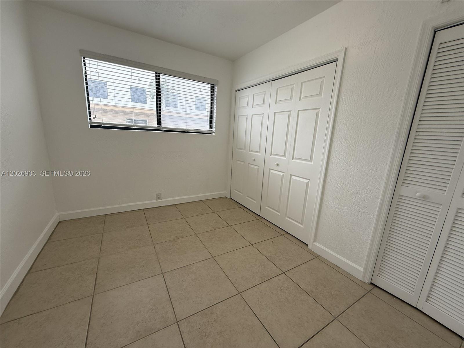 421 Southwest 6th Street, Unit 7 Miami, FL 33130 - Photo 5 of 8 an empty room with windows