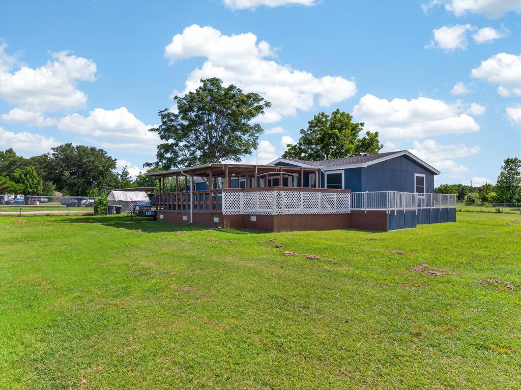 13051 Cherokee Road Sanger, TX 76266 - Photo 2 of 40 Large partial wrap around deck from front to back. Front is covered with tons of room to enjoy the outdoors