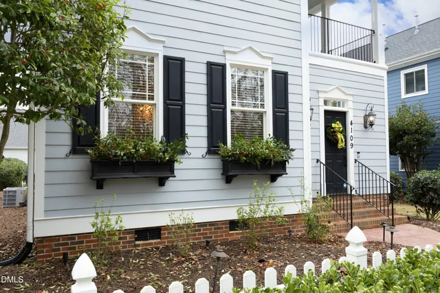 a kitchen with stainless steel appliances granite countertop a sink a stove oven a counter top space and cabinets