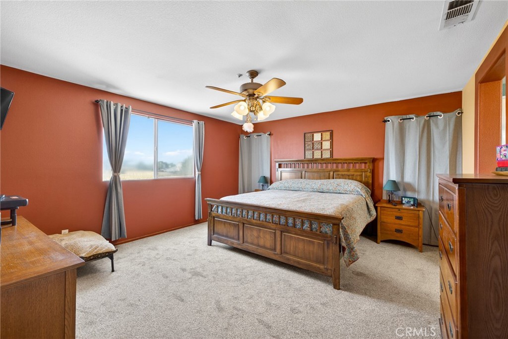 807 Lomond Drive Riverside, CA 92508 - Photo 29 of 47 Large primary bedroom accommodates king bed and multiple dressers.