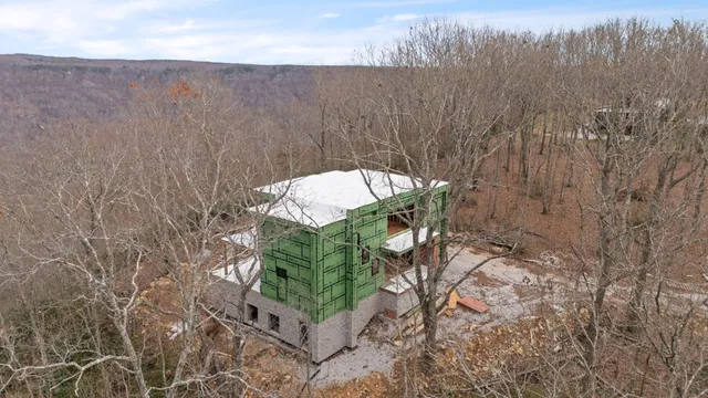 a view of a balcony with wooden floor