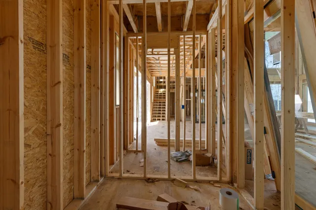 a view of a dry field with a mountain in the background