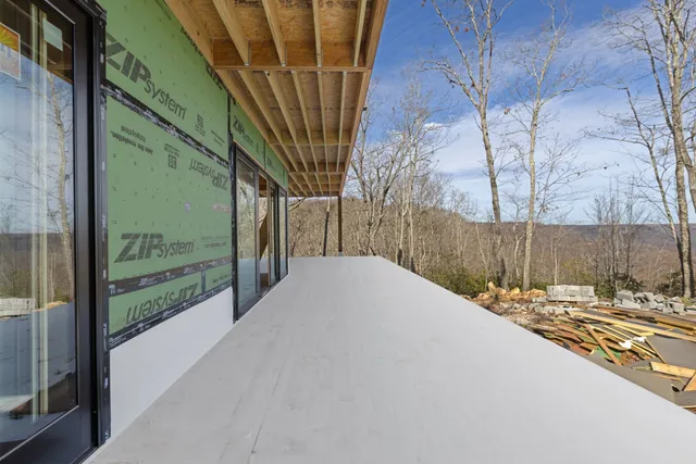 a view of a backyard with pathway