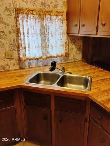 a stove top oven sitting inside of a kitchen