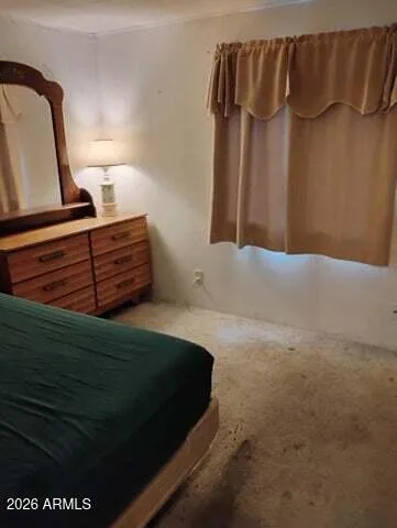 a room with a table chair and a wooden door