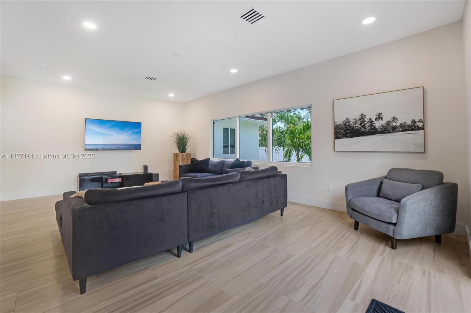 Biscayne Park Biscayne Park, FL 33161 - Photo 13 of 45 a living room with furniture and a flat screen tv