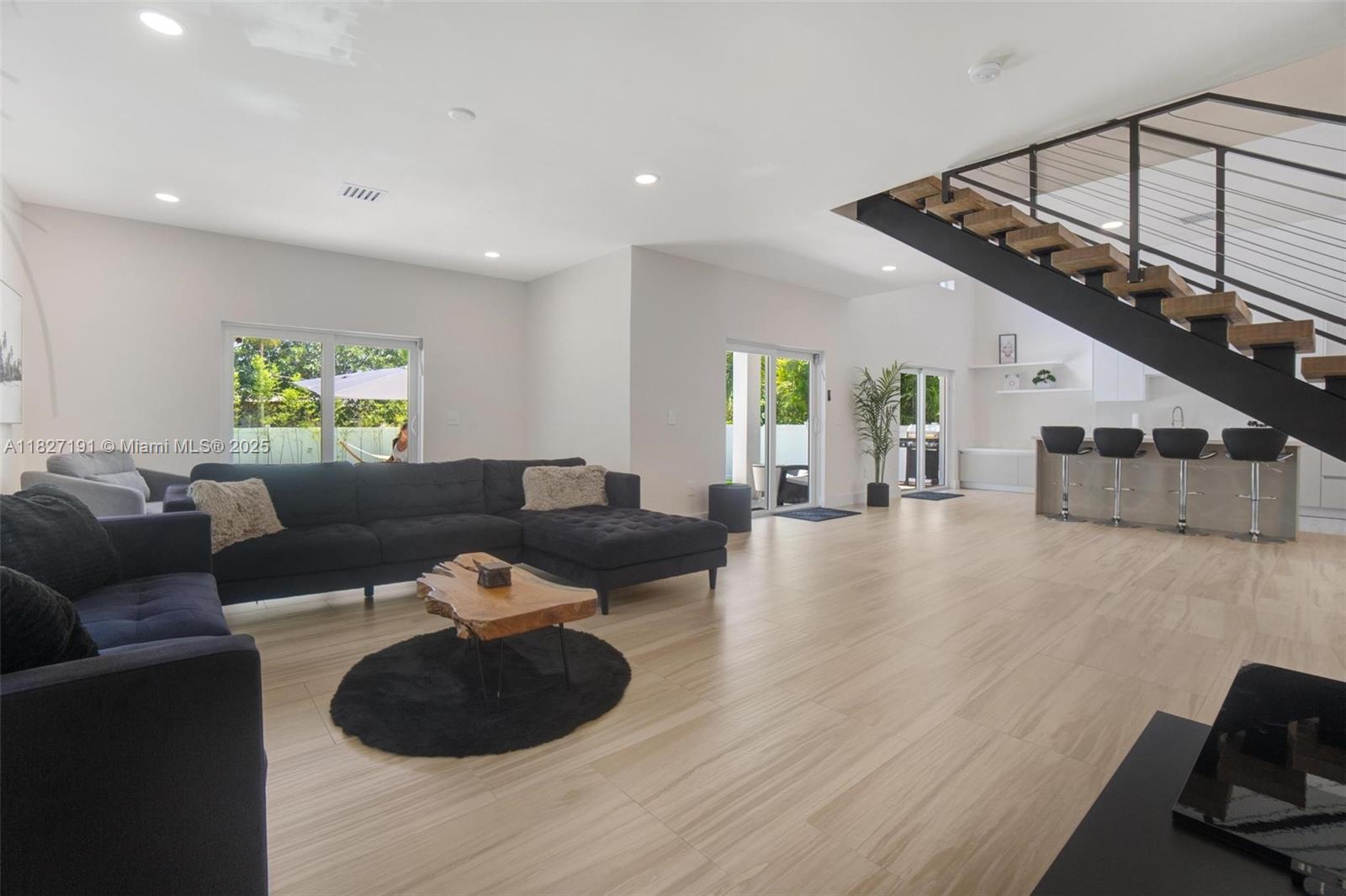 Biscayne Park Biscayne Park, FL 33161 - Photo 14 of 45 a living room with furniture and a wooden floor