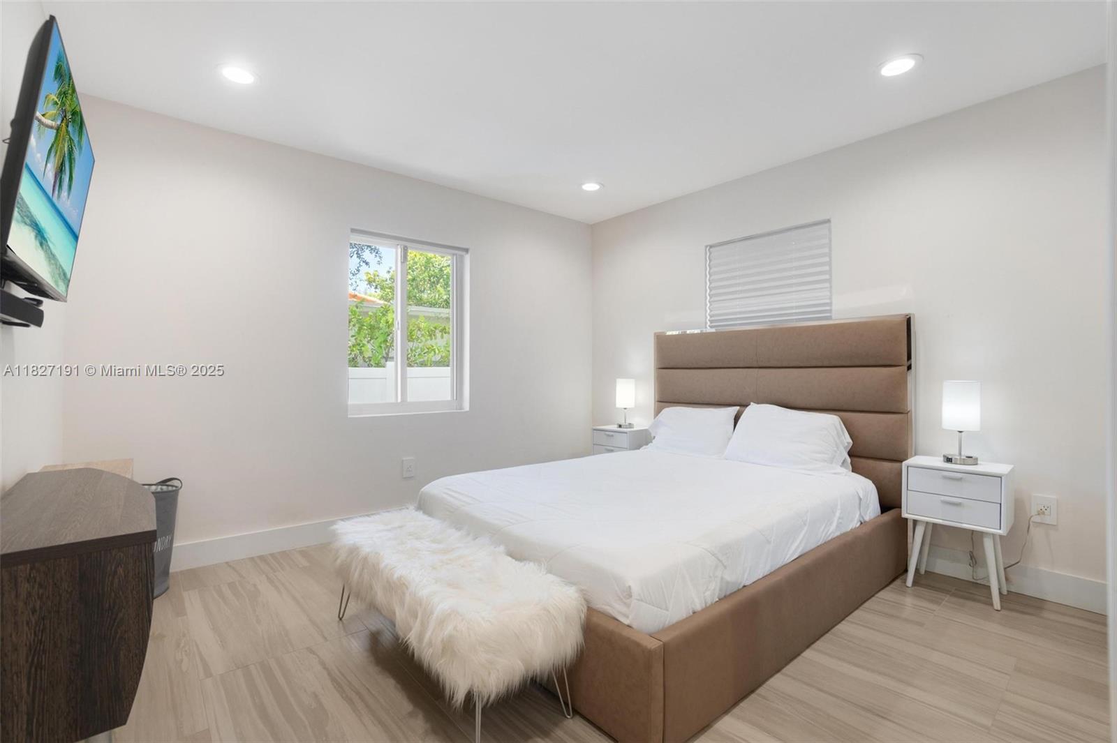 Biscayne Park Biscayne Park, FL 33161 - Photo 28 of 45 a bedroom with a bed and a flat screen tv