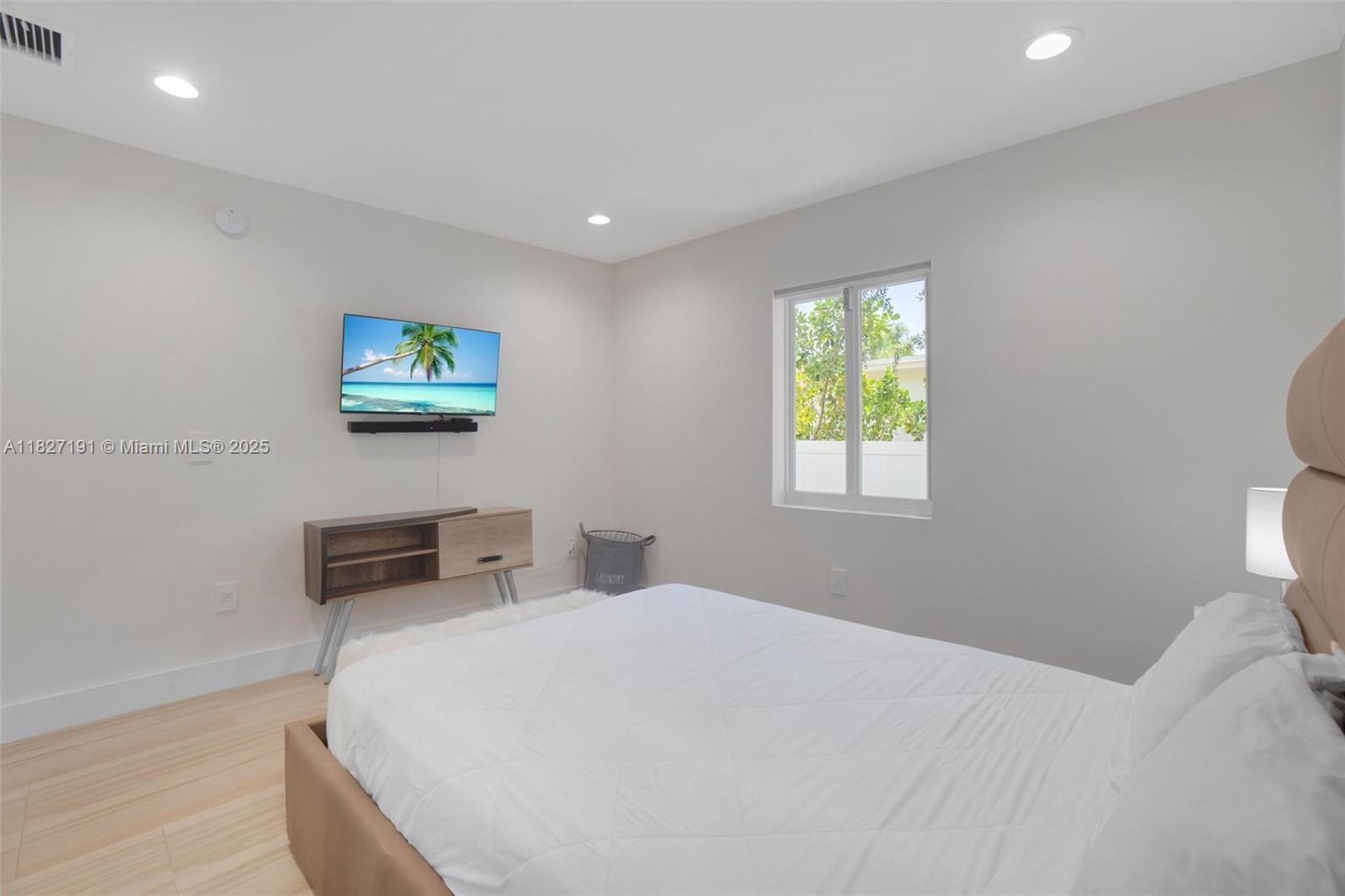 Biscayne Park Biscayne Park, FL 33161 - Photo 29 of 45 a bedroom with a bed and a window