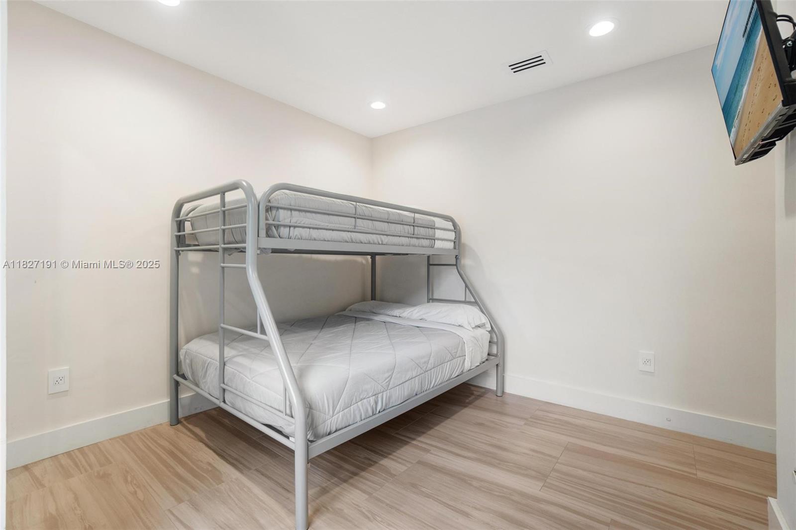 Biscayne Park Biscayne Park, FL 33161 - Photo 32 of 45 a room with a bed and a mirror