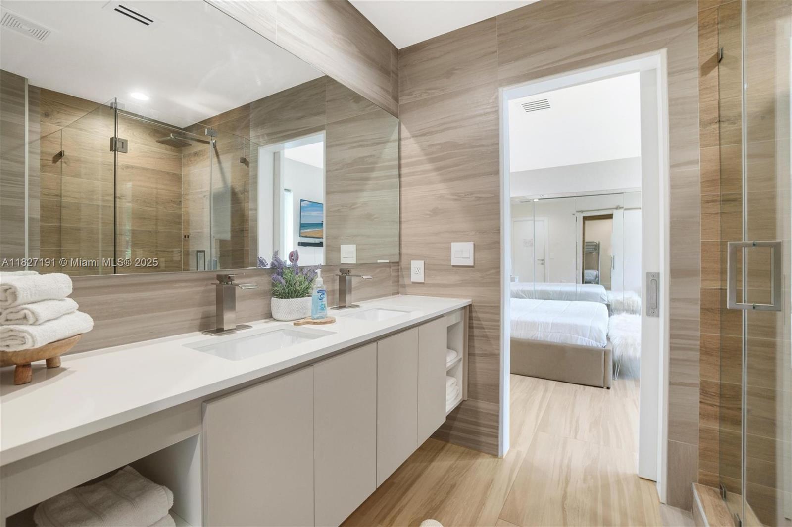 Biscayne Park Biscayne Park, FL 33161 - Photo 33 of 45 a bathroom with a double vanity sink and mirror