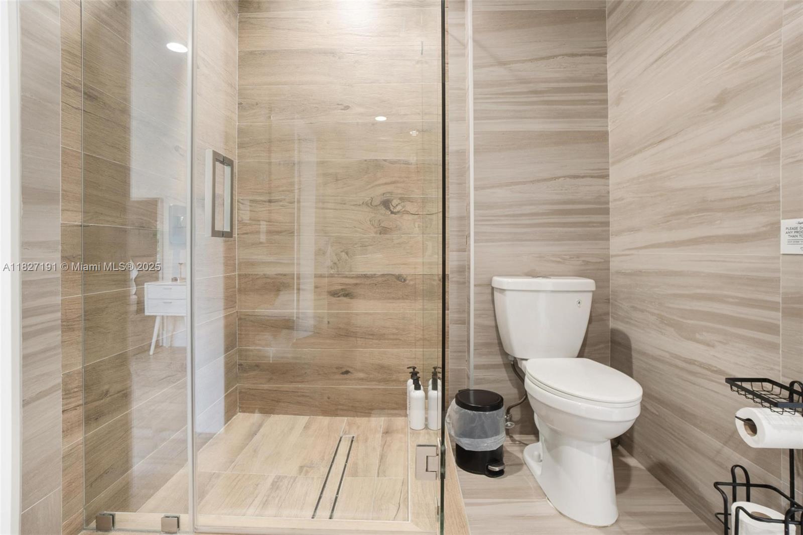 Biscayne Park Biscayne Park, FL 33161 - Photo 34 of 45 a white toilet sitting next to a bathroom sink